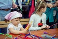 Charity Family festival Ã¢â¬â small girls participating at art and craft outdoor workshop